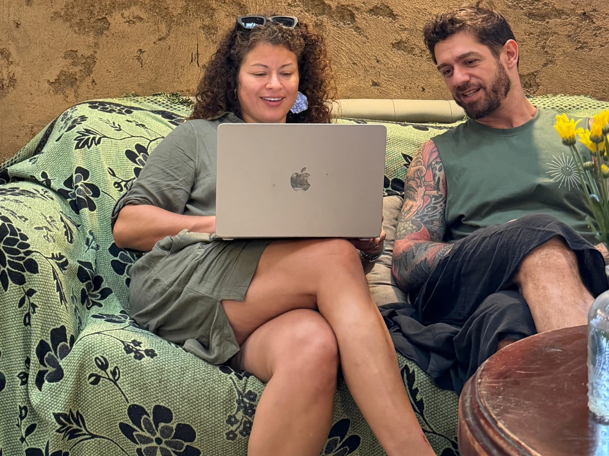 Rosi and a collaborator working together at a laptop